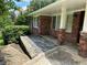 Lovely brick home exterior featuring a covered front entrance and stone walkway at 2711 Fairlane Dr, Atlanta, GA 30340