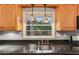Kitchen sink with black countertops and decorative pendant lights at 2711 Fairlane Dr, Atlanta, GA 30340