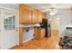 Kitchen with wood cabinets, stainless steel appliances, and hardwood floors at 2711 Fairlane Dr, Atlanta, GA 30340