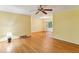 Spacious living room featuring hardwood floors and a classic ceiling fan at 2711 Fairlane Dr, Atlanta, GA 30340