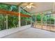 Bright sunroom with large windows offering views of the surrounding greenery at 2711 Fairlane Dr, Atlanta, GA 30340