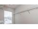 Walk-in closet features shelving and a window for natural light at 2850 Vining Ridge Ter, Decatur, GA 30034