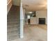Bright living room features plush carpet, fireplace, and staircase to upper level at 2850 Vining Ridge Ter, Decatur, GA 30034