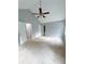 Bedroom featuring vaulted ceiling with fan, two closets, window and neutral carpet at 49 Patty Dr, Dallas, GA 30157