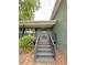 Inviting entrance with stairs leading to the front door, complemented by green siding at 49 Patty Dr, Dallas, GA 30157