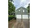 Two-story home featuring a two-car garage and traditional curb appeal at 49 Patty Dr, Dallas, GA 30157