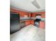 Functional kitchen featuring wood cabinets, black appliances, and neutral countertops at 49 Patty Dr, Dallas, GA 30157