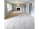 Spacious living room with neutral walls and a cozy fireplace at 49 Patty Dr, Dallas, GA 30157