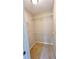 Small walk-in closet with wire shelves and neutral carpet at 49 Patty Dr, Dallas, GA 30157