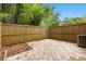 Fenced backyard featuring a concrete paver patio and mature trees at 100 Biscayne Nw Dr # C1, Atlanta, GA 30309