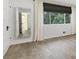 Bedroom with a view from the window, and decorative mirror on the wall at 100 Biscayne Nw Dr # C1, Atlanta, GA 30309
