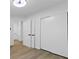 Bright bedroom with closet and doorway featuring luxury vinyl plank flooring at 100 Biscayne Nw Dr # C1, Atlanta, GA 30309