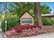 Arborgate Condominiums sign surrounded by colorful landscaping and lush greenery at 100 Biscayne Nw Dr # C1, Atlanta, GA 30309