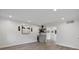 Bright and airy living room showcasing shiplap walls, modern lighting, and a stylish built-in bar area at 100 Biscayne Nw Dr # C1, Atlanta, GA 30309