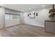 Bright and airy living room showcasing shiplap walls, modern lighting, and a stylish built-in bar area at 100 Biscayne Nw Dr # C1, Atlanta, GA 30309