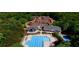Aerial view of community pool and tennis courts surrounded by lush greenery at 2613 Winterthur Main Nw, Kennesaw, GA 30144
