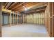 Unfinished basement with exposed framing, offering potential for customization at 2613 Winterthur Main Nw, Kennesaw, GA 30144