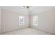 Well-lit bedroom with two windows and a ceiling fan at 2613 Winterthur Main Nw, Kennesaw, GA 30144
