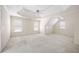 Large bedroom with an attic door and multiple windows at 2613 Winterthur Main Nw, Kennesaw, GA 30144