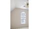 Bright bedroom with a arched window and a ceiling fan at 2613 Winterthur Main Nw, Kennesaw, GA 30144