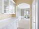 Bright dining room features white wainscotting, an archway, and French doors at 2613 Winterthur Main Nw, Kennesaw, GA 30144