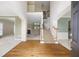 Spacious foyer showcasing hardwood floors, a staircase and an open floor plan at 2613 Winterthur Main Nw, Kennesaw, GA 30144