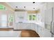Modern kitchen with bright cabinetry, natural light, and gas cooktop at 2613 Winterthur Main Nw, Kennesaw, GA 30144