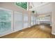 Open-concept living area with cathedral ceiling and large windows; hardwood floors and natural light add to the appeal at 2613 Winterthur Main Nw, Kennesaw, GA 30144