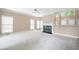 Spacious living area featuring a fireplace and abundant natural light at 2613 Winterthur Main Nw, Kennesaw, GA 30144