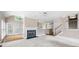 Open living room features hardwood, fireplace and stairs up to the second floor at 2613 Winterthur Main Nw, Kennesaw, GA 30144