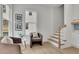 Cozy seating area with natural light, neutral color scheme, and stairs, creating a welcoming space at 826 Gaston Sw St, Atlanta, GA 30310