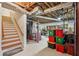 Unfinished basement with exposed ceiling, wooden stairs, and ample storage space at 1501 Memory Se Ln, Smyrna, GA 30080