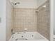 Bathroom with jacuzzi tub with beige tiling and updated fixtures at 1501 Memory Se Ln, Smyrna, GA 30080