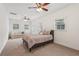 Bright bedroom featuring a neutral color palette with carpet, ceiling fans, and multiple windows at 1501 Memory Se Ln, Smyrna, GA 30080