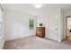 A well-lit bedroom features neutral tones, carpeted floors, and bright natural light from windows at 1501 Memory Se Ln, Smyrna, GA 30080
