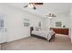 Bedroom featuring carpet, ceiling fans, multiple windows, a kitchenette and a couch at 1501 Memory Se Ln, Smyrna, GA 30080