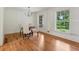 Bright dining room featuring hardwood floors, neutral paint and updated lighting at 1501 Memory Se Ln, Smyrna, GA 30080