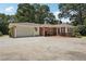 Well-maintained brick ranch with a two-car garage and an inviting brick patio area at 1501 Memory Se Ln, Smyrna, GA 30080