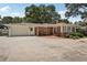 Charming brick ranch with a two-car garage, a brick patio, and mature landscaping at 1501 Memory Se Ln, Smyrna, GA 30080