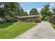 Charming brick home featuring a well-manicured lawn and inviting front porch at 1501 Memory Se Ln, Smyrna, GA 30080