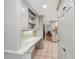 Walk through pantry space featuring granite countertop and neutral cabinets at 1501 Memory Se Ln, Smyrna, GA 30080