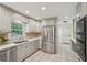 Spacious kitchen with stainless steel appliances, neutral cabinets and tile flooring at 1501 Memory Se Ln, Smyrna, GA 30080