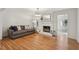 Bright living room with a painted fireplace, hardwood floors and natural lighting at 1501 Memory Se Ln, Smyrna, GA 30080