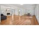 Open-concept living space with hardwood floors, fireplace, and a dining area at 1501 Memory Se Ln, Smyrna, GA 30080