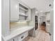 Walk through pantry space featuring granite countertop and neutral cabinets at 1501 Memory Se Ln, Smyrna, GA 30080