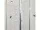 Glass enclosed shower with shower head, shelving and grab bar at 1501 Memory Se Ln, Smyrna, GA 30080