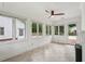 Cozy sunroom filled with natural light featuring tiled floors and fireplace at 1501 Memory Se Ln, Smyrna, GA 30080