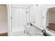 Updated bathroom featuring double sinks, granite countertop, subway tile, and contemporary mirrors at 2203 Second Ave, Decatur, GA 30032