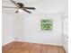 A bright bedroom with wood-look floors, ceiling fan, and window at 2203 Second Ave, Decatur, GA 30032