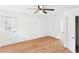Bedroom featuring wood-look floors, ceiling fan and a closet door and window at 2203 Second Ave, Decatur, GA 30032